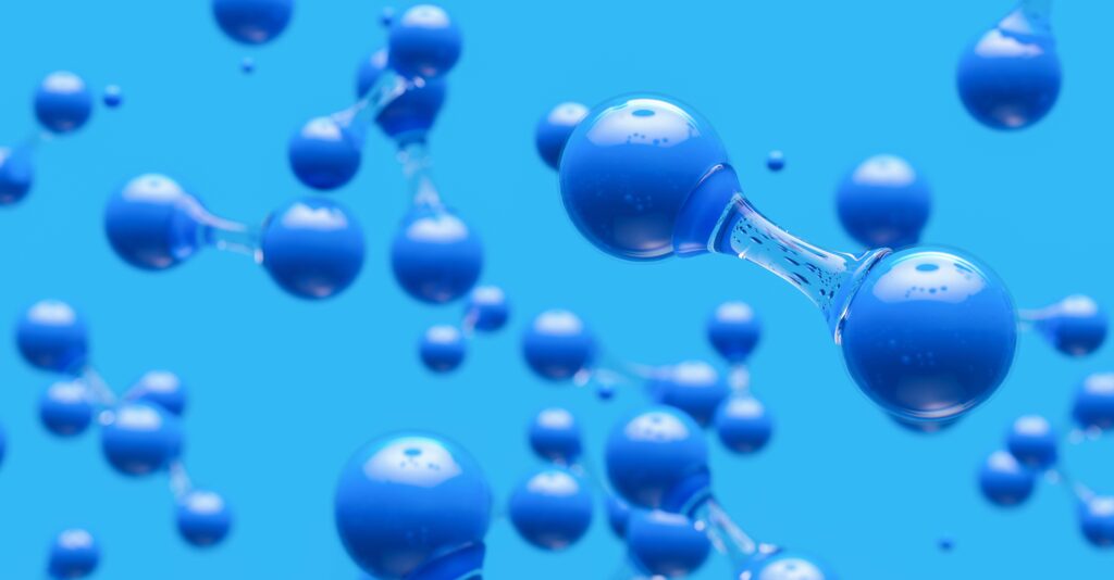 Sfondo azzurro. In primo piano due sfere blu unite da un segmento trasparente. La struttura è ripetuta in profondità e in larghezza nell'immagine. L'immagine vuole dare l'idea dell'acqua formata durante le reazioni del ciclo di Krebs.